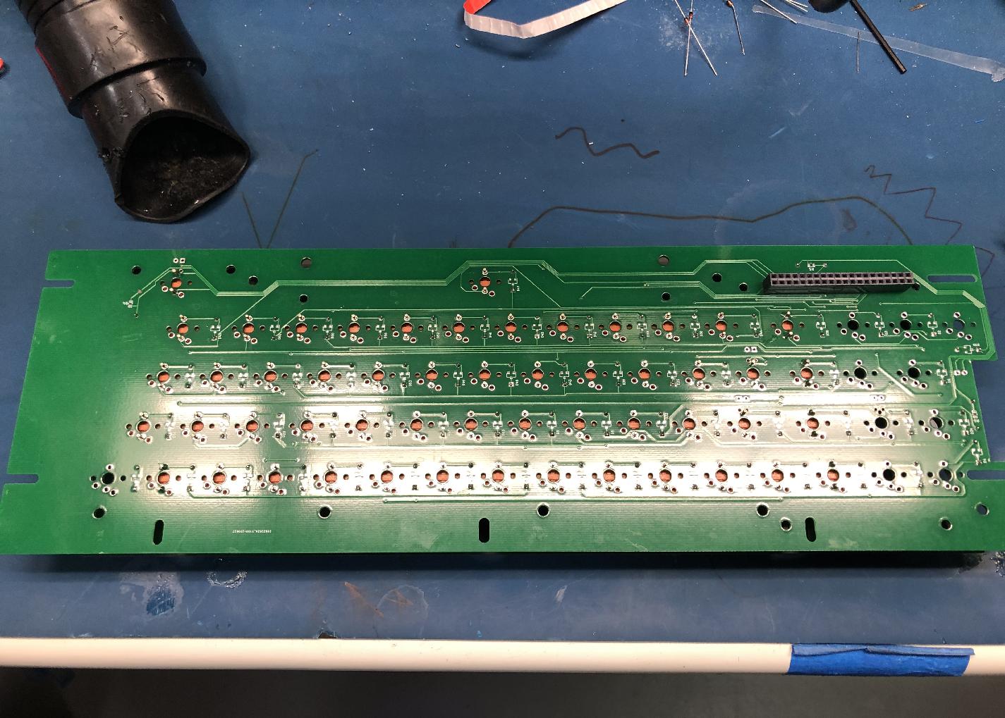 Connector is opposite side fromg the through-hole components