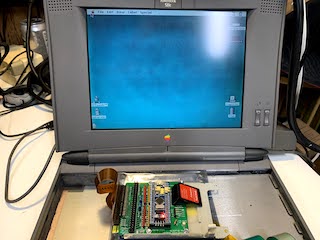 Picture of bluescsi_pb connected to PowerBook 520c