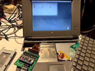 Picture of bluescsi_pb connected to PowerBook 520c